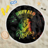 Round black beach blanket with white fringe edge and green Buffalo Soldier reggae graphic