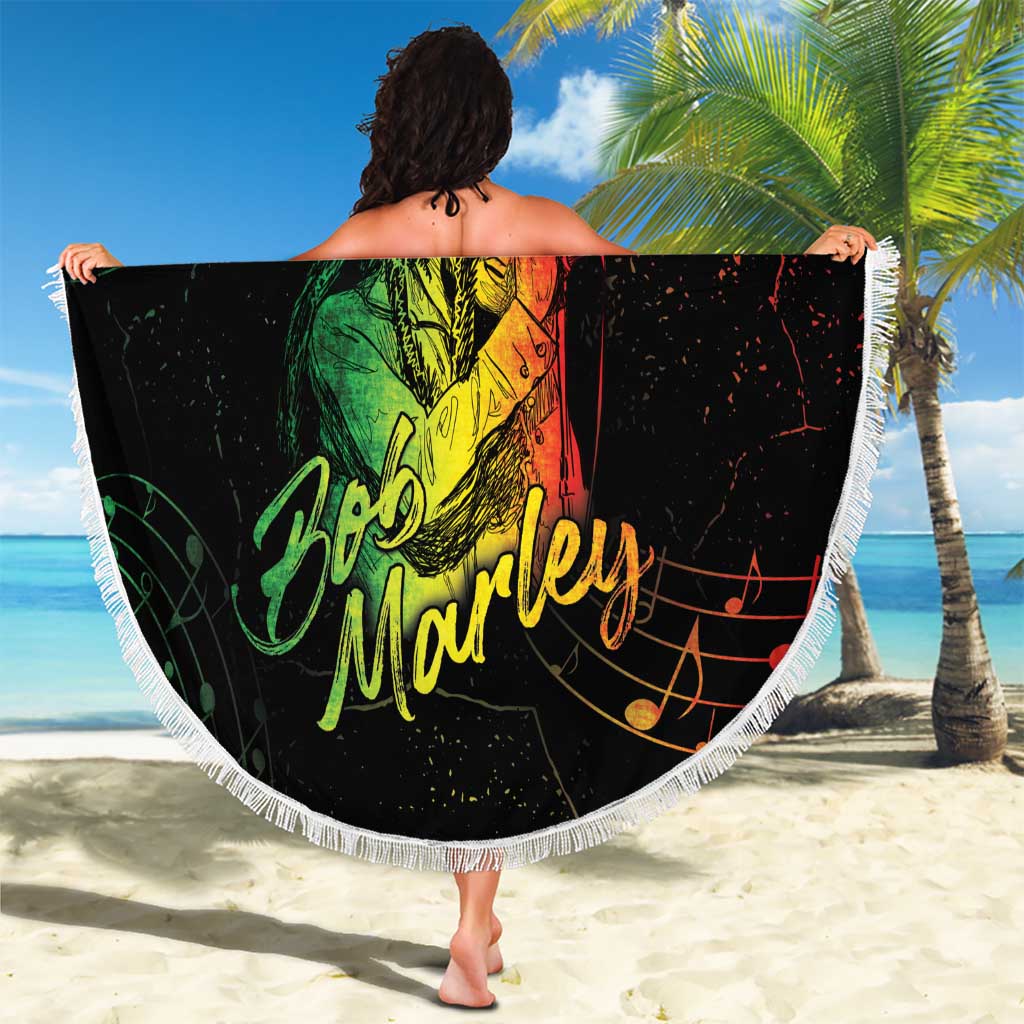 Round black beach blanket with white fringe, green Buffalo Soldier singer artwork