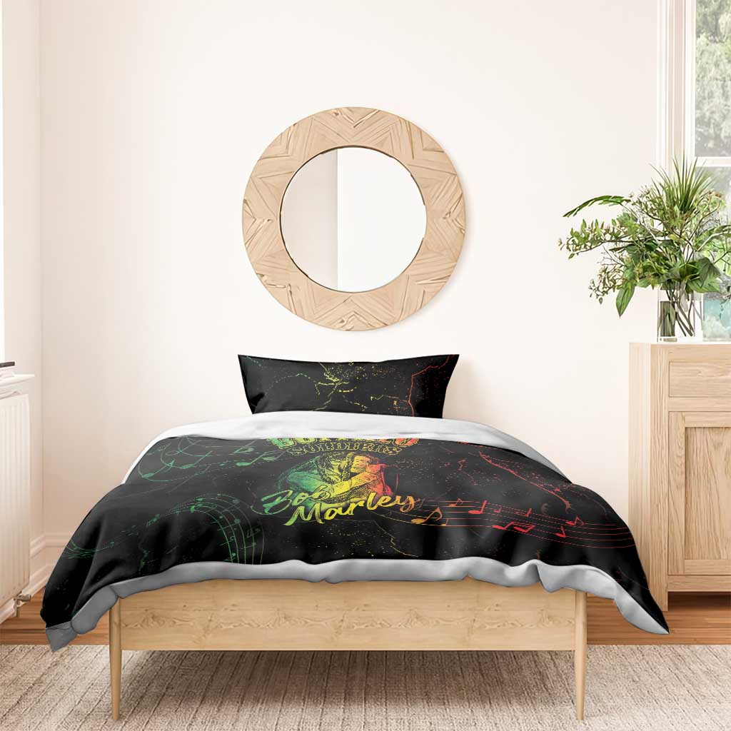 Black duvet with green “Buffalo Soldiers” and Bob Marley print on a bed with one pillow