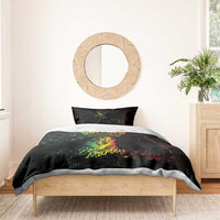 Black duvet with green “Buffalo Soldiers” and Bob Marley print on a bed with one pillow