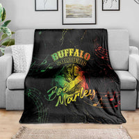 Black Buffalo Soldiers and Bob Marley print blanket spread across a couch