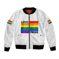 White unisex bomber jacket with full-zip front, rainbow LOVE WINS graphic, ribbed cuffs