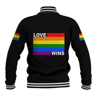 Black baseball jacket back with rainbow "LOVE WINS" graphic, striped ribbed collar and cuffs