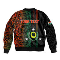 Black bomber jacket back with orange-green tribal print, 'YOUR TEXT' graphic, ribbed hem