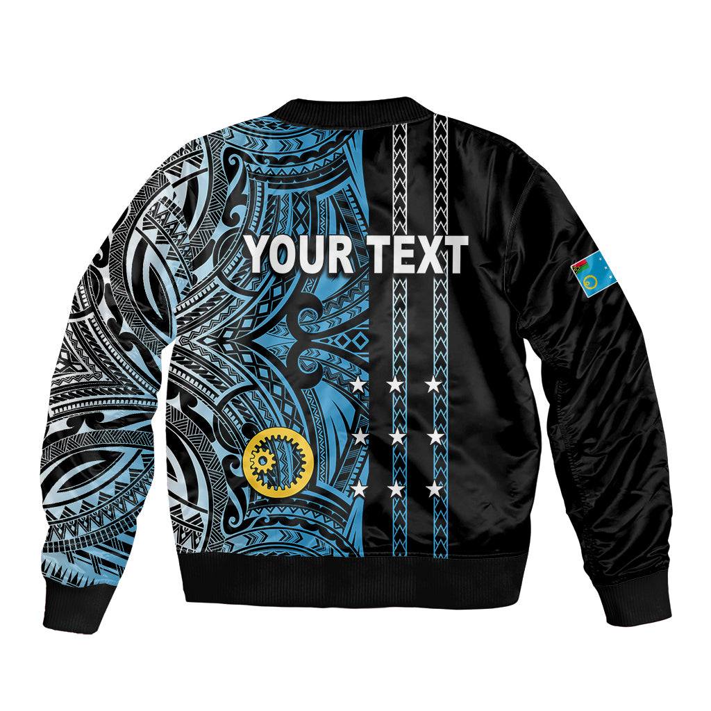 Black bomber jacket with blue tribal back panel, white patterns, ribbed cuffs and hem