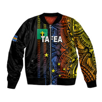 Black bomber jacket with colorful Polynesian-style tribal graphic on front and sleeves