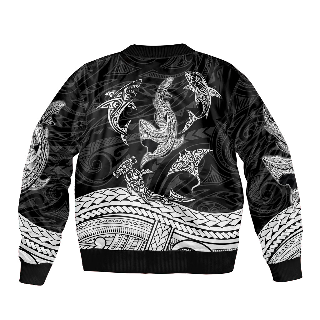 Black bomber jacket with white Polynesian shark tribal tattoo graphic, ribbed hem