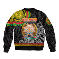 Black bomber jacket with back text 'MELANESIAN' and large central crest graphic