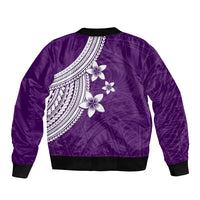 Purple bomber jacket back with white plumeria flowers and tribal-style patterned yoke, rib hem