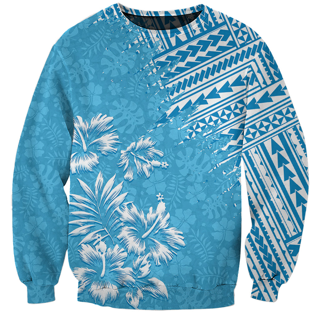 Unisex light blue sweatshirt with tropical palm print and tribal geometric panels