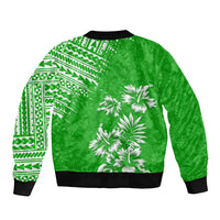 Green bomber jacket back view with white palm print and tribal sleeve panel, black hem