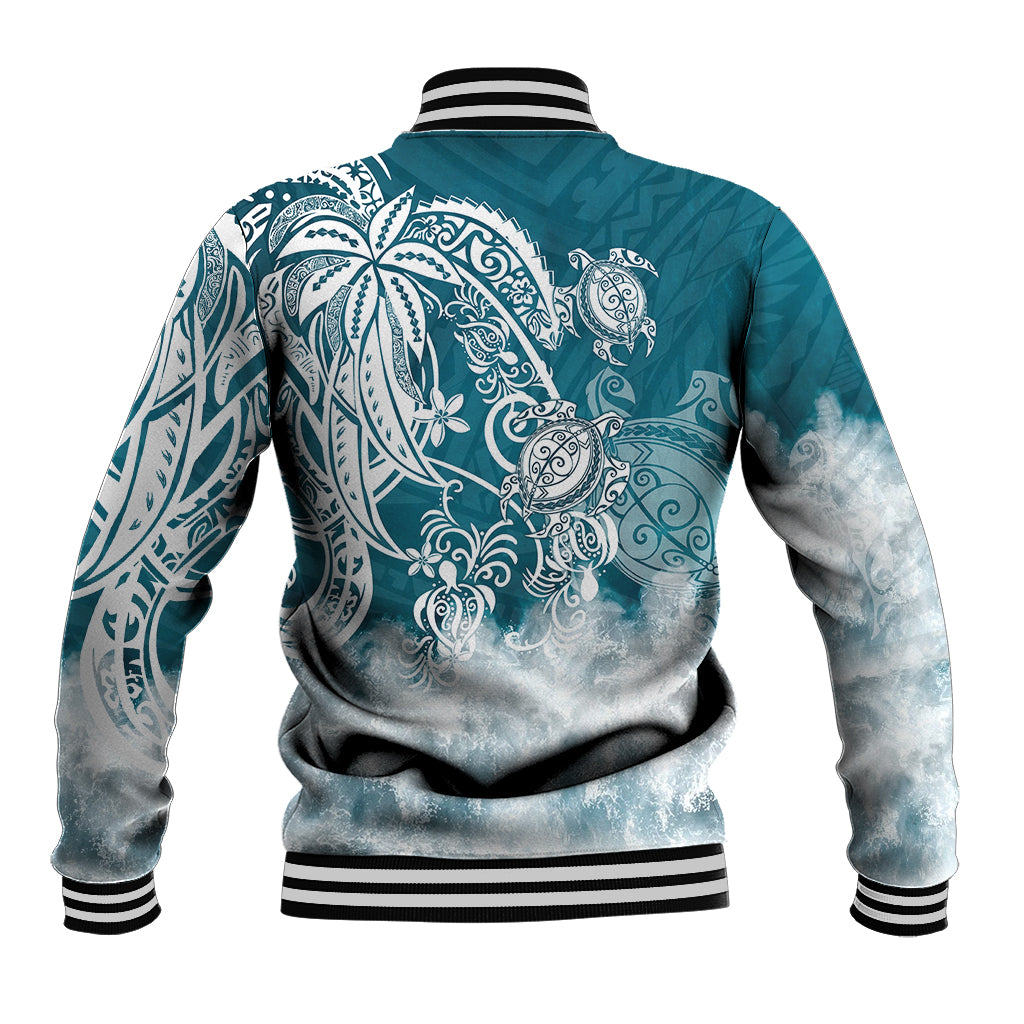 Back of teal baseball jacket with large tribal sea turtle print and striped rib cuffs