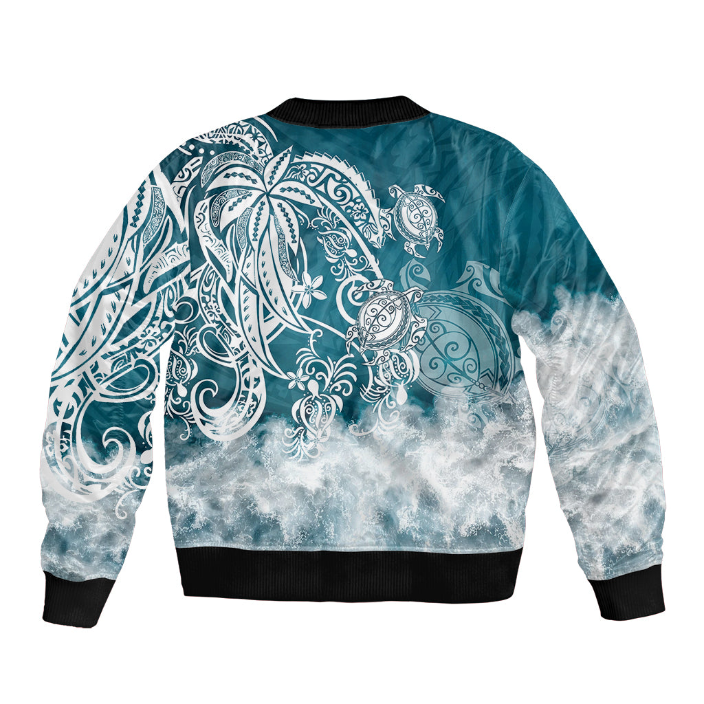 Unisex blue bomber jacket with ribbed hem and large back tribal sea turtle design