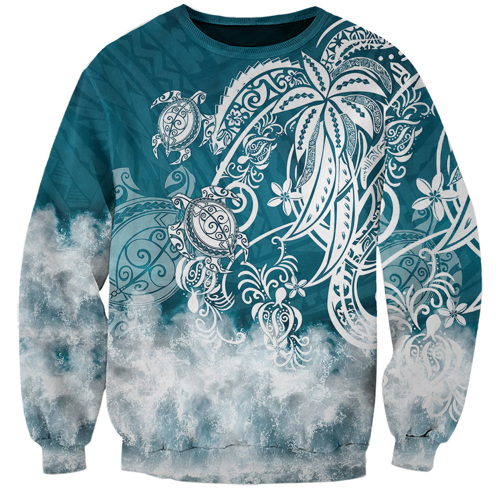 Turquoise crewneck sweatshirt with white tribal sea turtle graphic and cloud-like wave print