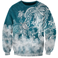 Turquoise crewneck sweatshirt with white tribal sea turtle graphic and cloud-like wave print