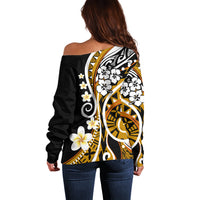 Off-shoulder sweater back view, black with gold frame and white flower accents