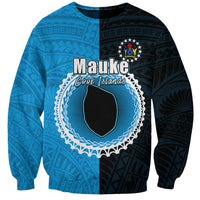 Unisex half-and-half sweatshirt with blue and dark panels, circular Mauke graphic front