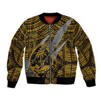 Gold bomber jacket with black ribbed trim, front zipper, bold claw-style tribal print