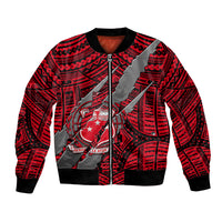 Red bomber jacket with black ribbed trim, front zipper, tribal coat-of-arms graphic