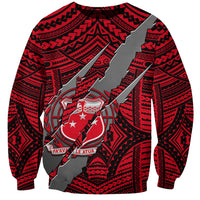 Red Polynesian sweatshirt with tribal print and clawed coat of arms emblem