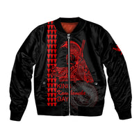 Black bomber jacket with front zipper, ribbed cuffs, red Hawaiian graphic