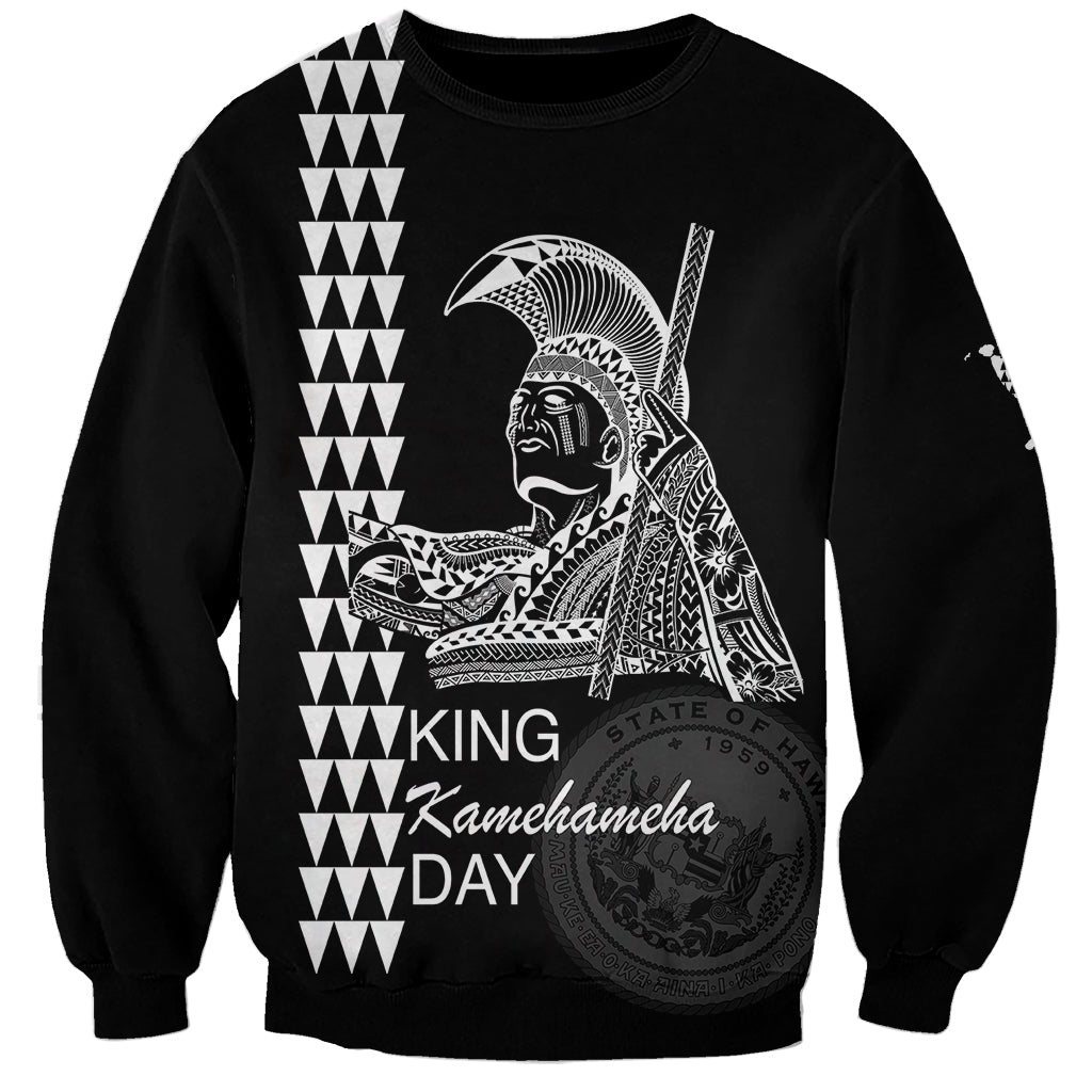 Black crewneck sweatshirt with King Kamehameha Day graphic, seal, and zigzag pattern