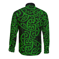 Green long-sleeve button shirt with Maori pattern, back view