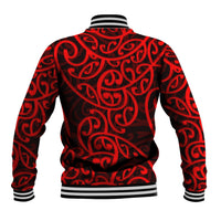 Red baseball jacket back with black Maori-style swirling pattern and striped ribbed hem