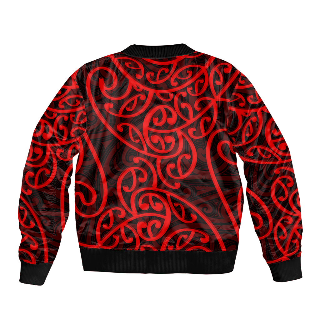 Red bomber jacket with bold black-and-red Maori-style swirls, ribbed collar and cuffs