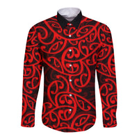 Red long-sleeve button shirt with black Maori swirl pattern and pointed collar