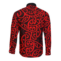 Back of red long-sleeve button shirt with black Maori swirl pattern