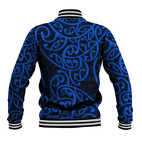 Blue varsity baseball jacket with Maori-style swirl pattern, ribbed cuffs and striped collar