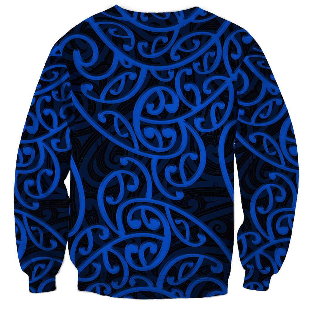 Blue crewneck sweatshirt with Maori-style black and blue swirling pattern
