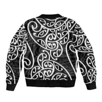 Bomber jacket with back Maori-style swirls in black and white, ribbed hem and cuffs