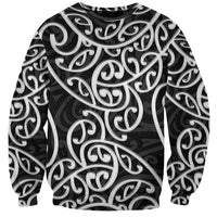 Unisex sweatshirt with black-and-white swirling Maori-style pattern, crew neck, long sleeves