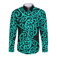 Long sleeve button shirt with turquoise Maori swirl pattern, black collar and cuffs
