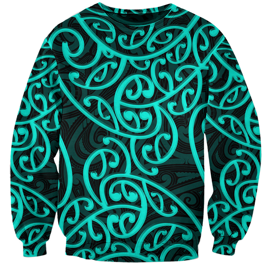 Unisex crewneck sweatshirt with turquoise and dark green swirling Maori-style pattern