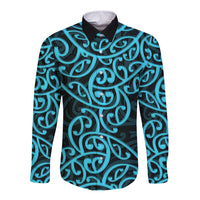 Long sleeve button shirt with Maori-inspired swirl pattern, teal and black, front view