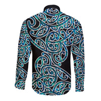 Back long sleeve button shirt with Maori pattern, teal and blue swirls on dark base