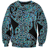 Unisex crewneck sweatshirt with black base and teal-green tribal swirl print