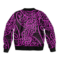 Bomber jacket back, dark purple/black Maori swirl pattern, ribbed cuffs and hem