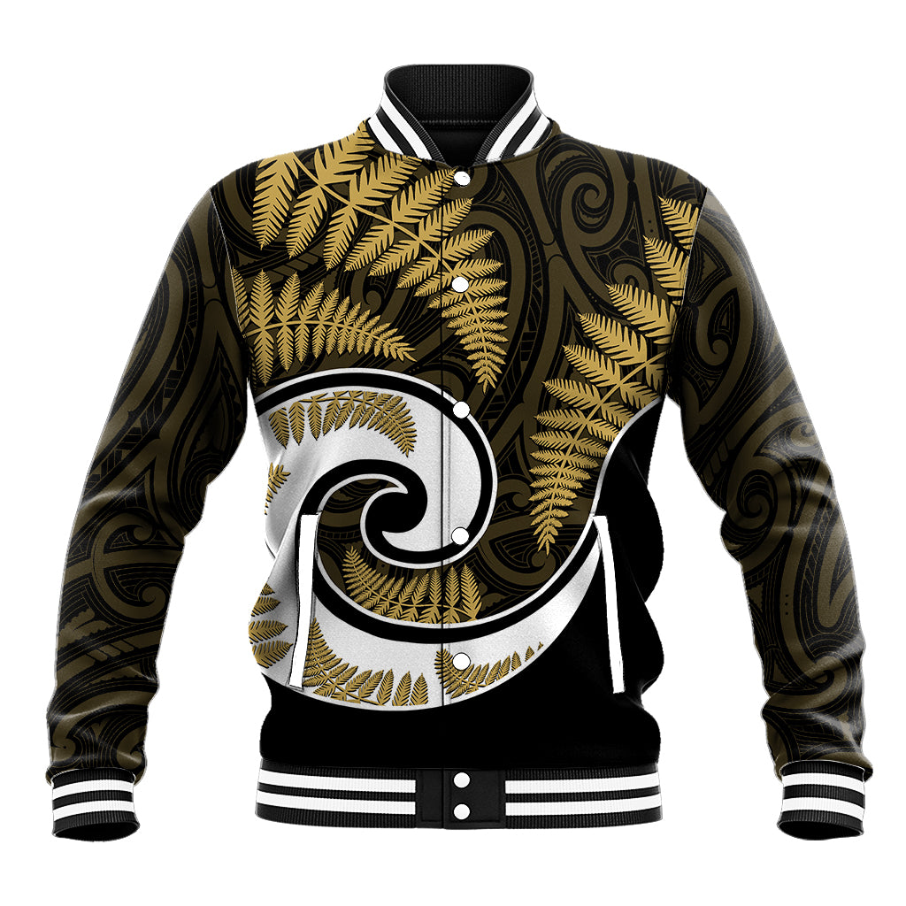 Gold-and-black baseball jacket with white Maori-style emblem, striped ribbed collar and cuffs