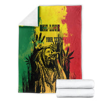 Personalized blanket stack with reggae grunge face graphic in green, red, and yellow