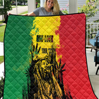 Reggae grunge quilt blanket with green, yellow, and red panels and bold central artwork