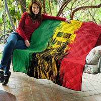 Reggae grunge quilt blanket with green, yellow, and red sections and vivid portrait artwork