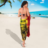 Personalized sarong draped over the body with reggae grunge portrait in green, red, and yellow.