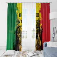 Window curtain pair with top rings, green and red sides, bright yellow-and-black graphic print.