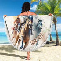 Round beach blanket with fringe edge, horse racing artwork, held up on sunny beach