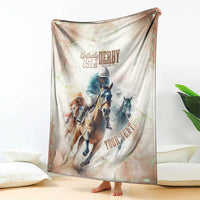 Beige horse racing blanket draped with Kentucky Derby 151st text and running horses