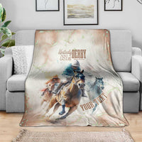 Beige horse racing blanket on sofa with Kentucky Derby 151st crest and “YOUR TEX…” text